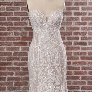 Maggie Sottero Lace Strapless Wedding Dress in Ivory over misty mauve.
